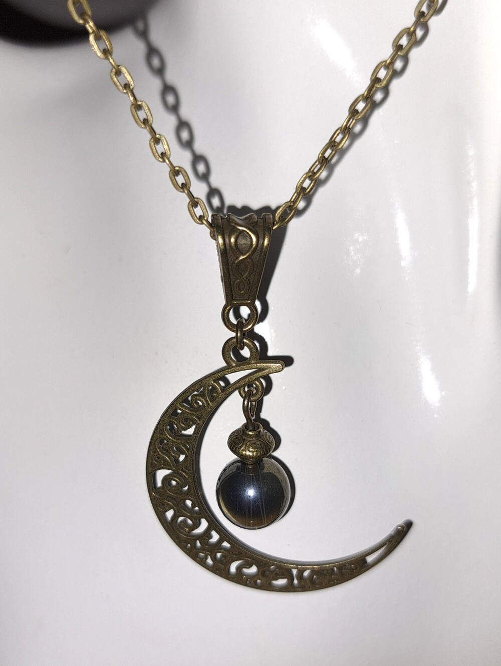 Filigree Crescent Pendant Necklace in Antique Bronze, Metallic Sheen Glass Bead